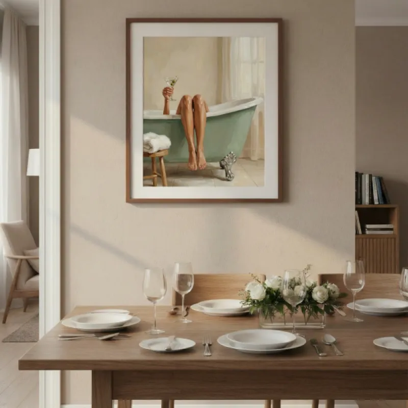 Woman in sage green clawfoot bathtub holding a martini glass, legs draped over the edge, towel on wooden stool.