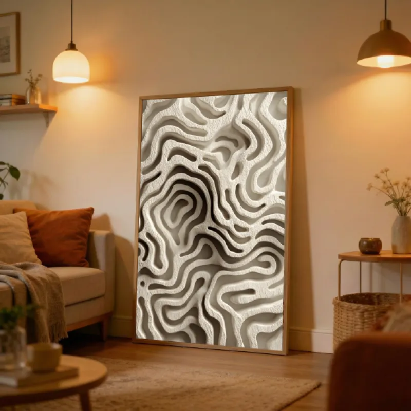 Close-up of an abstract sculptural relief with flowing organic ridges in cream and warm beige tones.