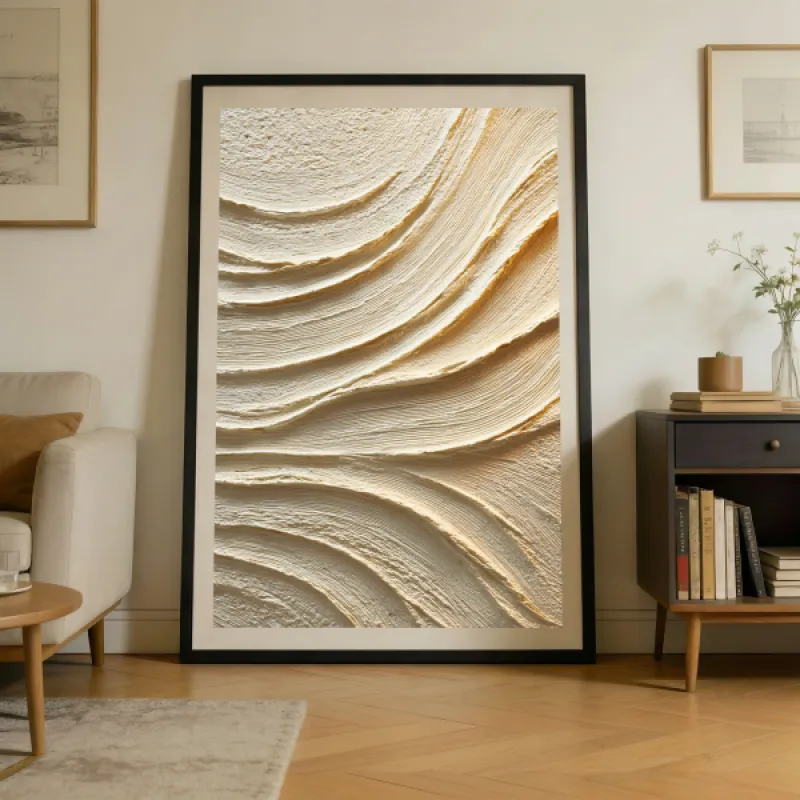 Close-up of layered sweeping texture ridges in cream and soft gold, abstract relief artwork.