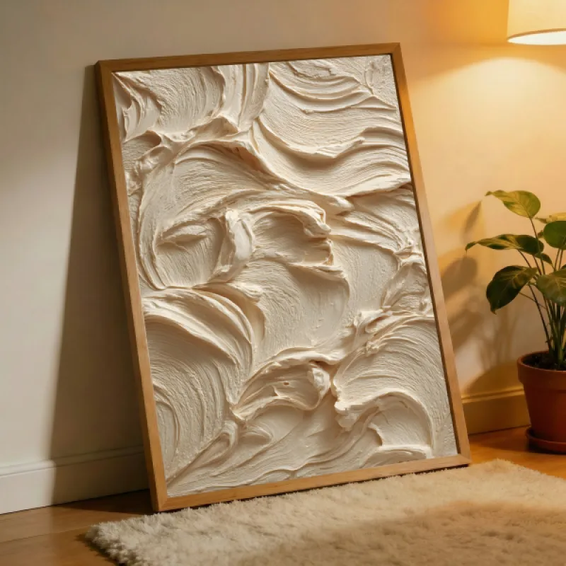 Close-up of swirling cream-coloured texture with soft rounded strokes in beige and off-white.